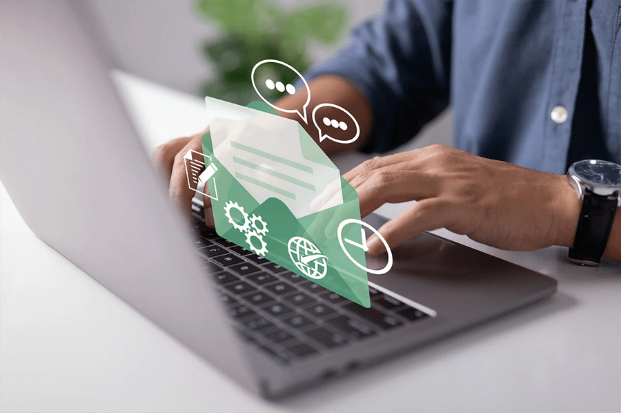 Person typing on a laptop with digital graphics of an open envelope and communication icons overlayed on the image.